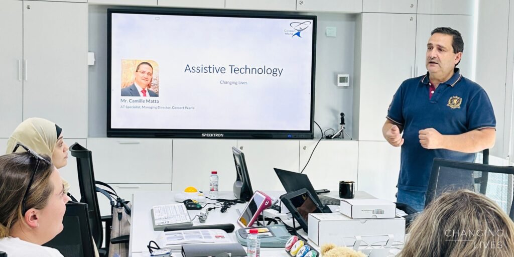 Camille Matta presenting an assistive technology workshop to a group of therapists