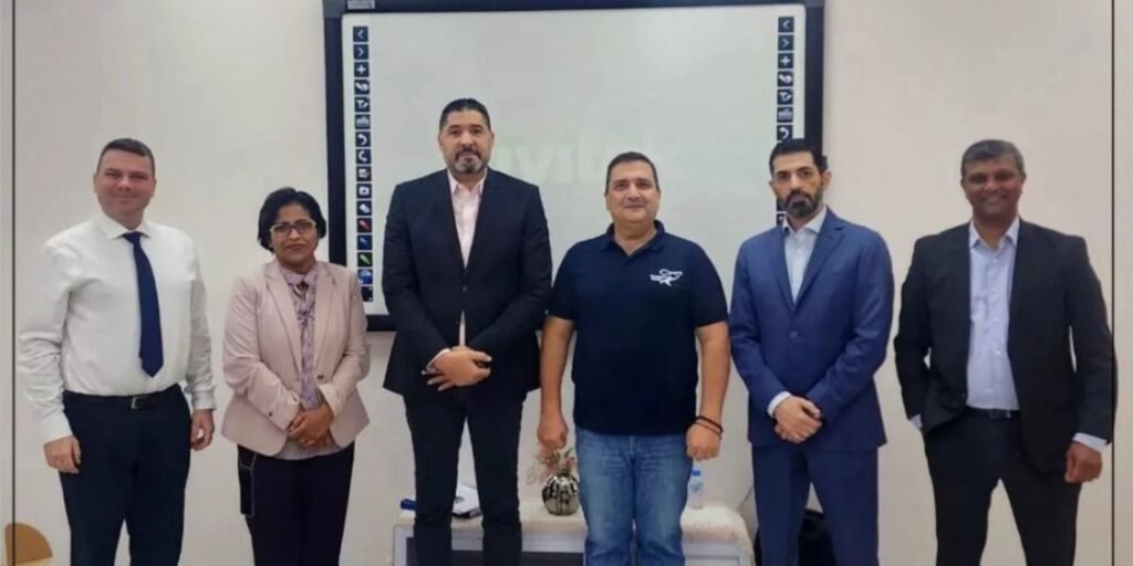 Consort World representatives with school leaders in Kuwait